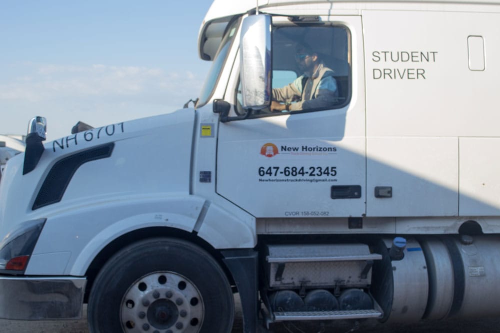 Close-up of student driver cab with instructor inside